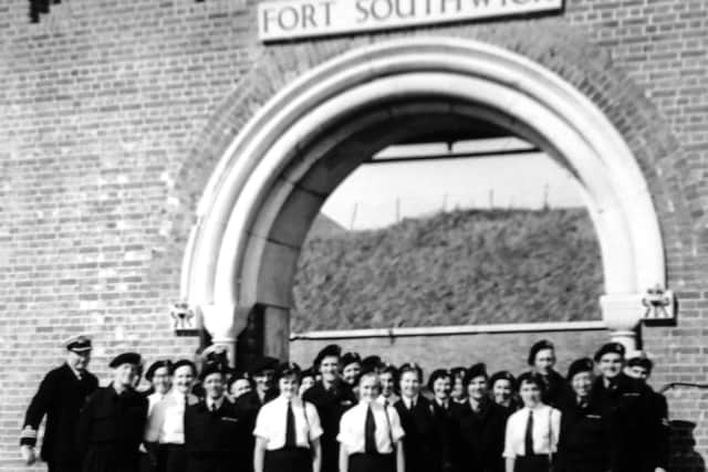 Duty Wrens pose outside Fort Southwick in 1956 with their C/O Commander Titheridge.