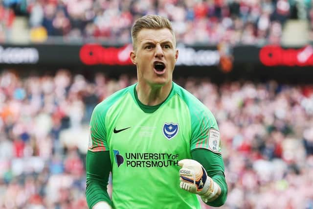 Goalkeeper Craig MacGillivray celebrates his penalty shootout save. Picture: Joe Pepler