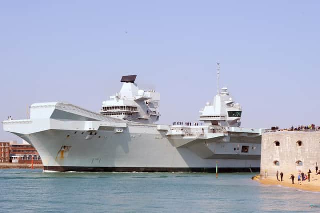 HMS Queen Elizabeth leaving Portsmouth Naval Base. (010419-4445)