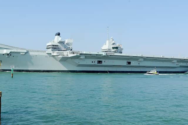 HMS Queen Elizabeth leaving Portsmouth Naval Base. (010419-4756)