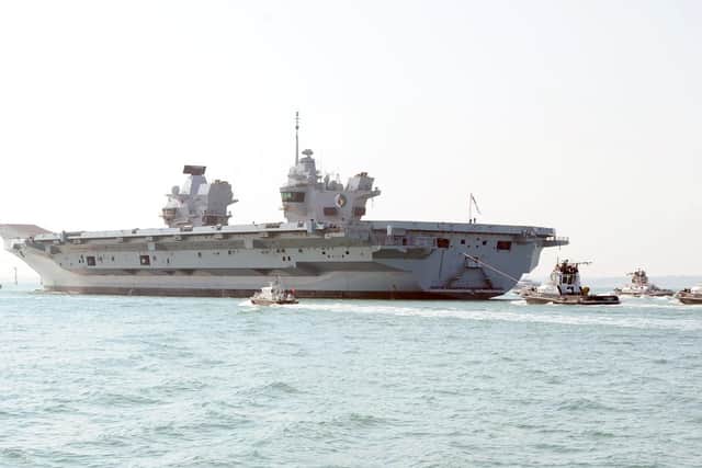 HMS Queen Elizabeth leaving Portsmouth Naval Base. (010419-4472)