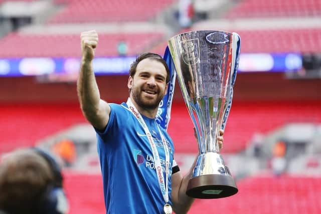 Brett Pitman fought back from exiled from Pompey's playing squad to captaining them to Checkatrade Trophy victory. Picture: Joe Pepler