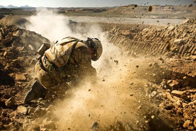Royal Marine Commandos from  11 Troop, M Company, 42 Commando fire 51mm light mortars in to the Afghan village of Chinah, after receiving incoming fire from 107mm Chinese Rockets, Rocket Propelled Grenades and small arms fire from Taliban Insurgents . Photo: PO (PHOT) Sean Clee