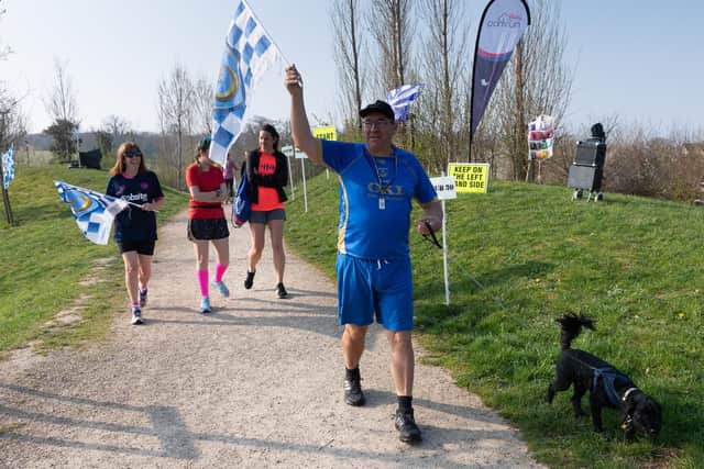 Pictured is: Wendy and Andrew Smith with Pompey flags