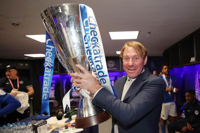 Eric Eisner holds aloft the Checkatrade Trophy Picture: Joe Pepler