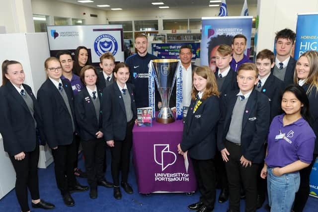 Pupils, University of Portsmouth ambassadors and Jack Whatmough and Mark Catlin from Portsmouth FC with the Checkatrade trophy.
Picture: Sarah Standing (020419-4945)