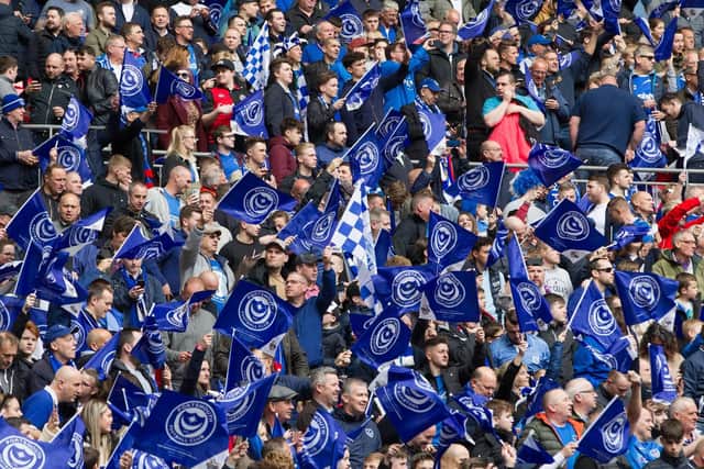 Plenty Pompey flags waving in the crowd as excitement builds for the match. Picture: Dave Taylor/ LMSMag