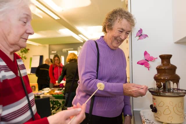 (L-R) Dawn Moreland and Trix Hayward try out the chocolate fountain.
Picture: Duncan Shepherd