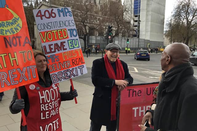 Passerby Hugh Buchanan talks to the protesters
Picture: Tom Cotterill