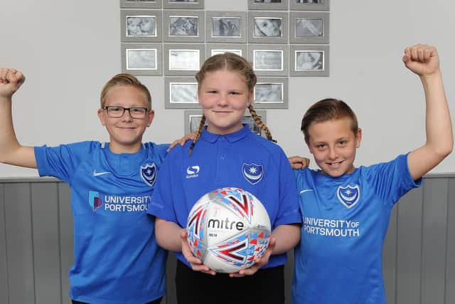 Pompey fans, twins Billy and Alfie Glover, 11, with their sister Lottie Golver, 10.

Picture: Habibur Rahman