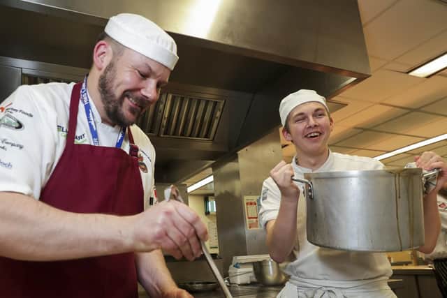 Royal Navy chefs and stewards team up with students at Havant and South Downs College to cook a special lunch in aid of Rowans Hospice. Picture: MoD/Crown Copyright
