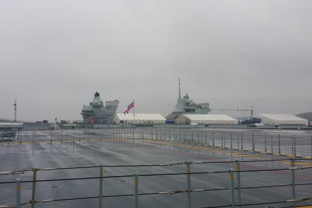 A view of HMS Prince of Wales from HMS Queen Elizabeth, which has now safely navigated into Rosyth Dockyard. Picture: @HMSQNLZ on Twitter