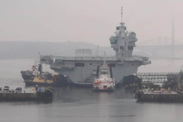 The narrow gap HMS Queen Elizabeth faced as she was reversed into Rosyth Dockyard today. Picture: @HMSQNLZ on Twitter