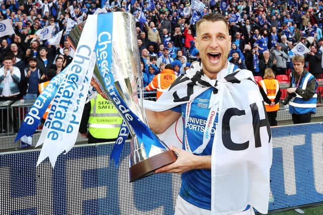 Lee Brown celebrates Pompey's Checkatrade Trophy triumph. Picture: Joe Pepler