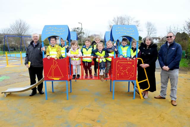 Cllr Gerry Kelly, children from Big Discoveries Nursery, Cllr Sue Bell, and Andrew Smith from Wicksteed Playground