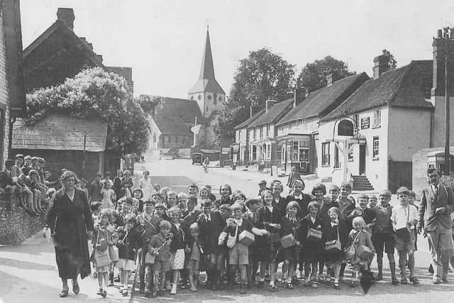 Evacuated children from Battersea who arrived at South Harting with their teacher Mr W Greetham on the far right.