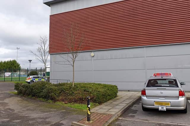 The silver taxi at scene this morning at Mountbatten Leisure Centre in Portsmouth which belongs to the victim, Albert Xhediku. Photo: Victoria Jones/Solent News & Photo