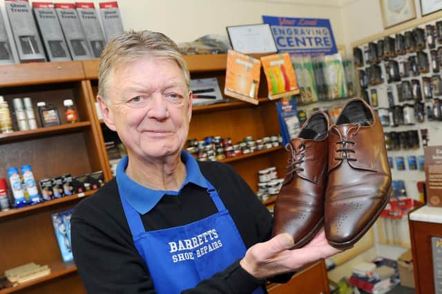 As good as new - Clive Barrett (62), owner of Barrett's Shoe Repairs, with a pair of resoled shoes.
Picture: Sarah Standing (220319-2785)