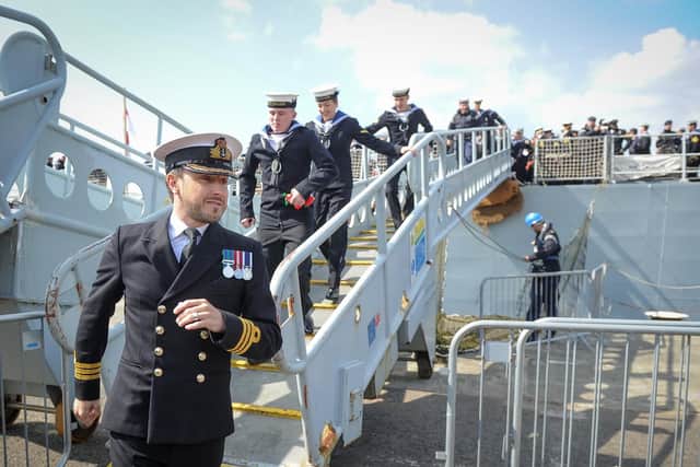 Captain Mike Carter Quin stepping off HMS Dragon
