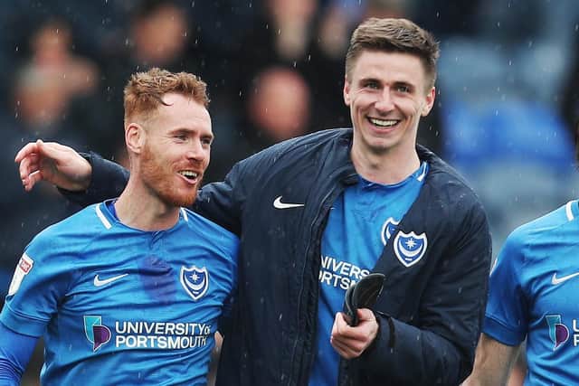 Oli Hawkins, right, and Tom Naylor toast Pompey's win. Picture: Joe Pepler