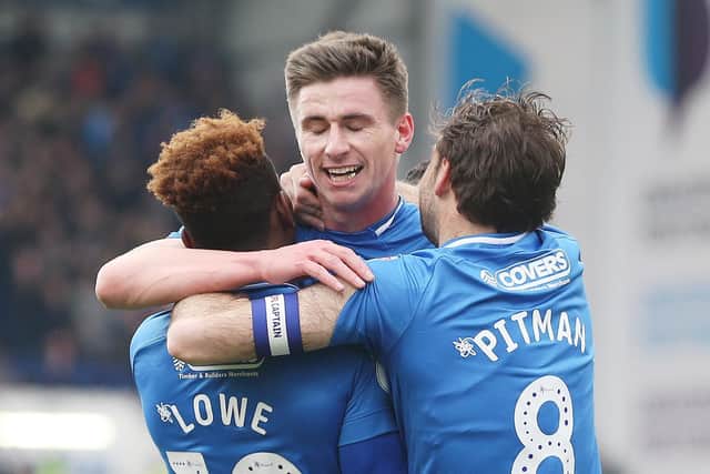 Pompey celebrate Oli Hawkins' opener against Rochdale. Picture: Joe Pepler