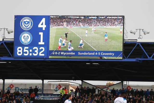 The Fratton Park big screen shows Pompey beating Rochdale and Sunderland losing to Coventry. Picture: Joe Pepler