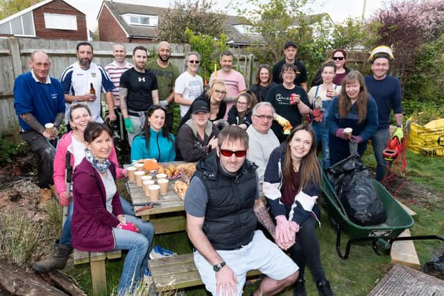 Volunteers with Ricky (centre) and fiancee Clarrisa Knight (centre right). Picture: Duncan Shepherd