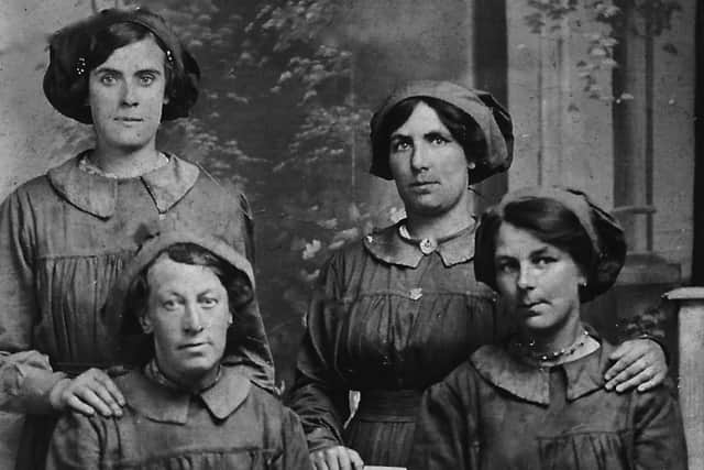 These Portsmouth women are wearing a uniform of some kind but can anyone recognise who or what these girls might be? Picture: Rosemary Hutchins.