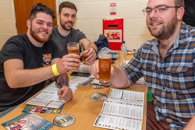 (l-r) Richard Bateman, Cassidy Noyes and Phil Kirkham all from Fareham enjoying their beers. (060419-037)