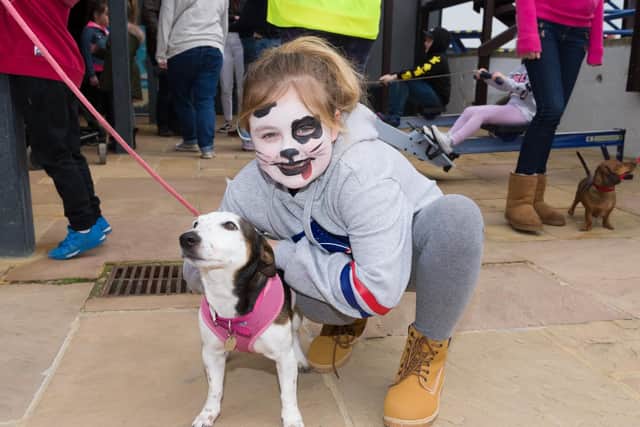 Lexi Leworthy with 'Lola'. World Water Day event - Local school kids have been collecting plastic and created sculptures,  on display in the pub. There was also a beach clean litter pick, face painting and an indoor rowing machine competition. Picture: Duncan Shepherd