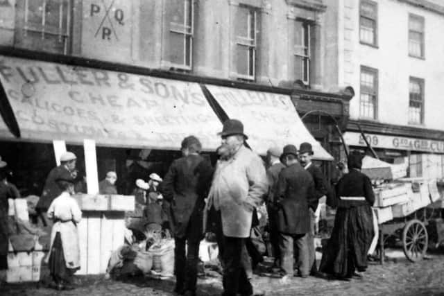 Fuller & Sons drapers store in Commercial Road, Portsmouth, just up from Charlotte Street junction. Does anyone know what PQR signifies?  Photo: Barry Cox postcard collection.