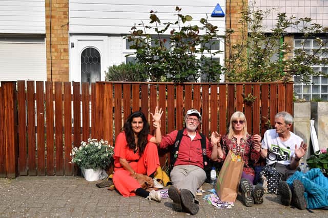 Climate change activists glued their hands together and locked themselves to the fence outside Jeremy Corbyn's north London home. Picture: Daniel Leal-Olivas/AFP/Getty Images.