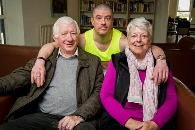 Anthony Sims with his parents Mike and Jo Sims. Picture: Habibur Rahman
