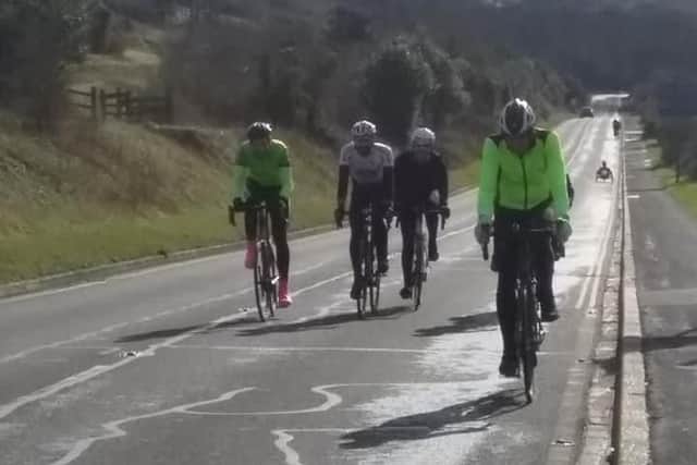 Ross Fripp cycling up Southwick Hill for Smile4Wessex