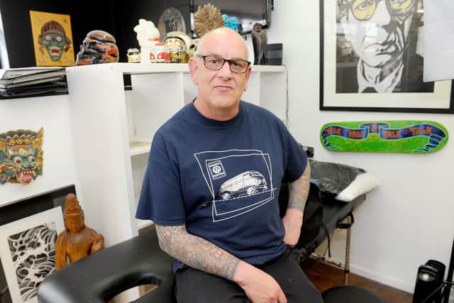 Simon Bishop at tattoo studio Kolours based in Kingston Road, Portsmouth. Picture: Sarah Standing (190419-6359)