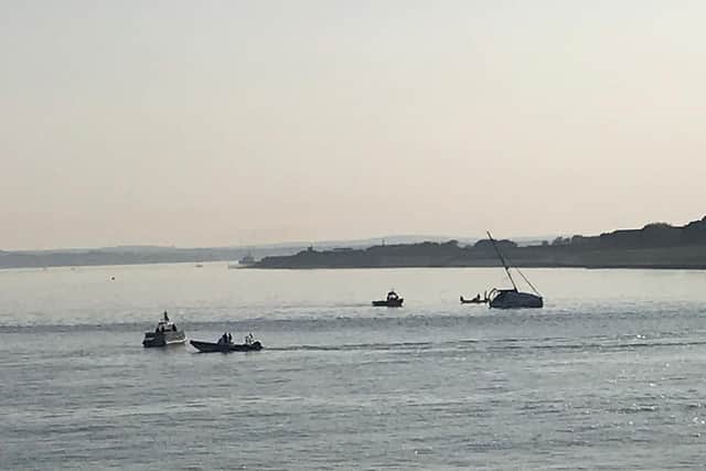 Boat which is close to capsizing near hotwalls in Old Portsmouth. Picture: Byron Melton