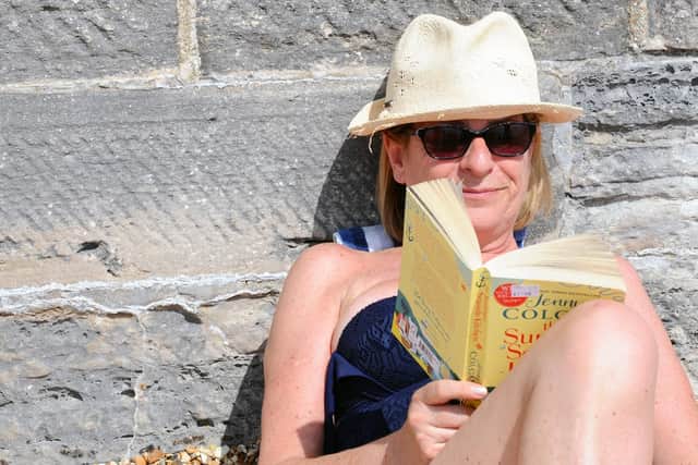 Ann Carroll from Southsea reading a book as she enjoys the warm weather. Picture: (190419-5478)