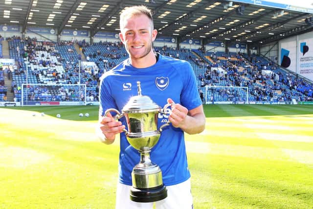Pompey defender Matt Clarke with The News/Sports Mail player of the season trophy for the 2017-18 campaign. Picture: Joe Pepler