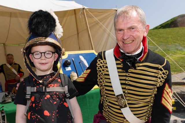 Ethan Bonynge-Kitching, 7, wearing Sergeant Roger Glancefield's Royal Artillary head gear.
Picture: Duncan Shepherd
