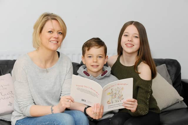 Tabatha Throup with her children Jonny, eight, and Tegan 11. Picture: Sarah Standing (150419-4942)