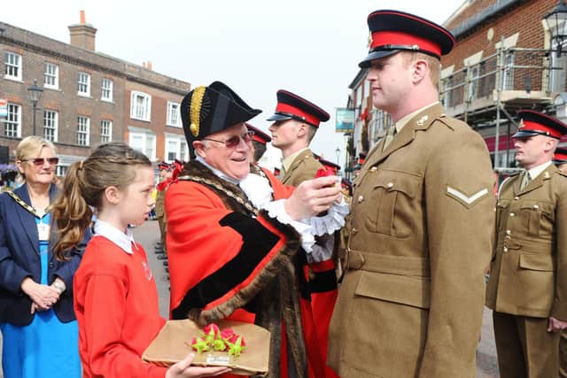 Pictured is: The Mayor of Havant Peter Wade presenting a soldier with the Emsworth Rose.

Picture: Sarah Standing (230419-6666)