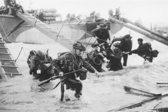 Juno Beach D-Day Landings. Troops from the 48th Royal Marines at Saint-Aubin-sur-mer on Juno Beach, Normandy, France, during the D-Day landings, 6th June 1944. (Photo by Hulton Archive/Getty Images)