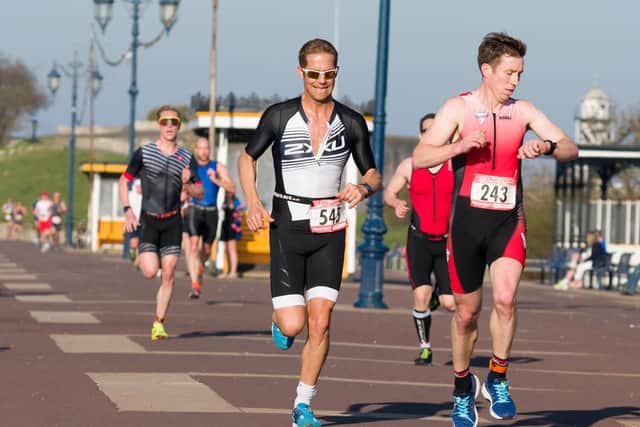 Neil Collins and Christopher Tildesley at the front of the first leg 10k with Rob Arkell in pursuit. Picture: Duncan Shepherd