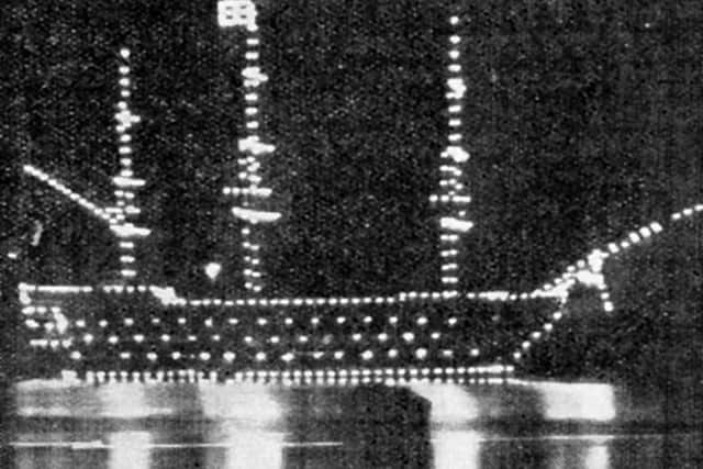 HMS Victory illuminated in 1905, a century after Trafalgar.