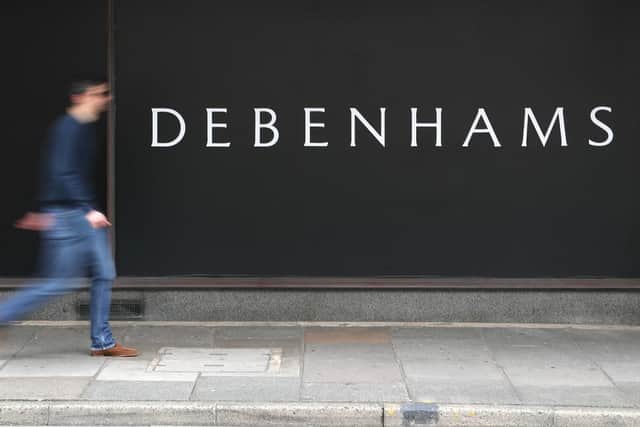 A person walks past Debenhams department store in Southsea Picture: Andrew Matthews/PA Wire