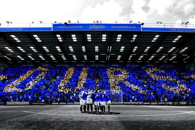Pompey fans hold up "Ours" on the opening day of the 2013/4 season against Oxford at Fratton Park
Picture and copyright: Joe Pepler