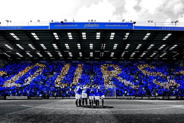 Pompey fans hold up "Ours" on the opening day of the 2013/4 season against Oxford at Fratton Park
Picture and copyright: Joe Pepler