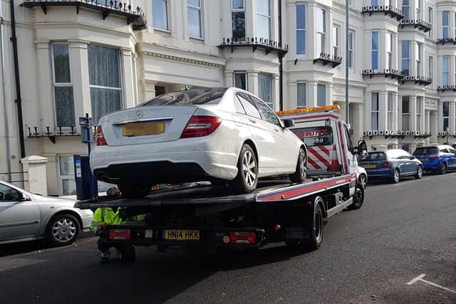 Malikah Richards' Mercedes being impounded after being caught with a Tipp-Ex doctored parking ticket 
Picture: Portsmouth City Council