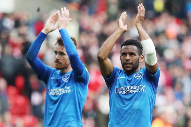 Tom Naylor, left, and Nathan Thompson applaud the Pompey fans after their's side's draw at Sunderland. Picture: Joe Pepler