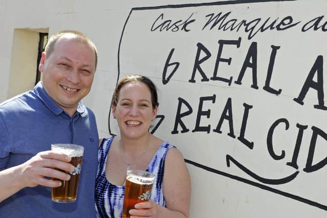 Dev and Ali Wearn celebrate after their pub The Lawrence Arms in Southsea won the Portsmouth and SE Hants CAMRA pub of the year award. 
Picture: Ian Hargreaves  (200419-1)